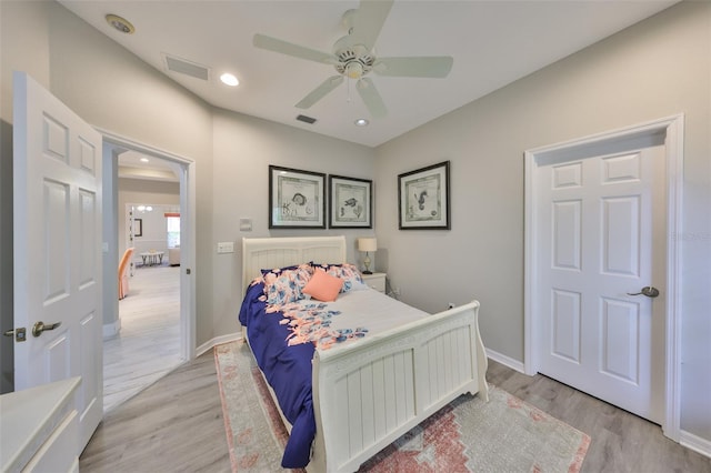 bedroom featuring recessed lighting, baseboards, visible vents, and light wood finished floors