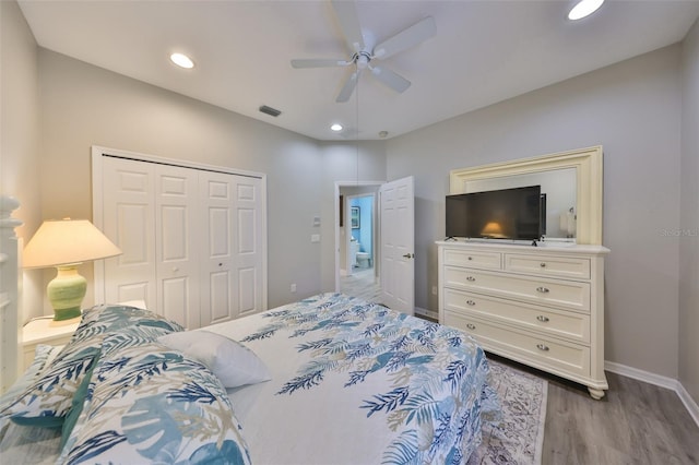 bedroom featuring baseboards, ceiling fan, light wood-type flooring, a closet, and recessed lighting