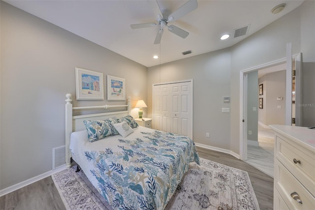 bedroom featuring light wood finished floors and visible vents