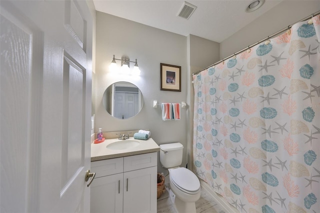 bathroom with a shower with shower curtain, visible vents, vanity, and toilet