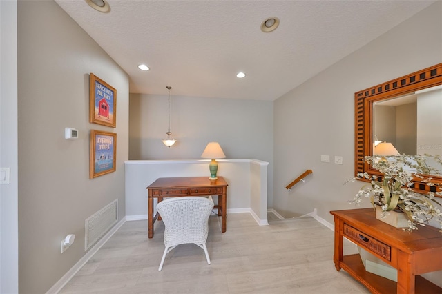 home office with baseboards, visible vents, light wood-style flooring, and recessed lighting