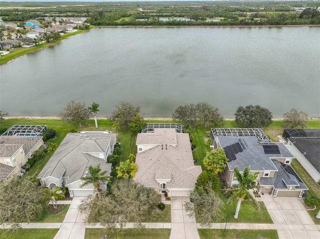 birds eye view of property featuring a water view and a residential view