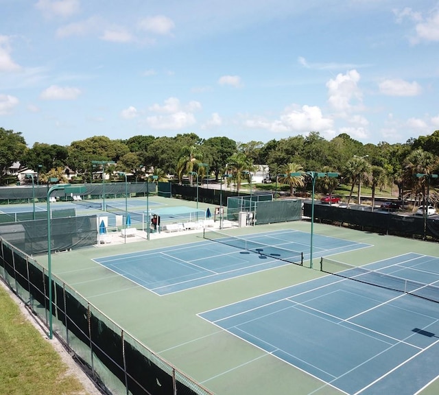 view of sport court with fence