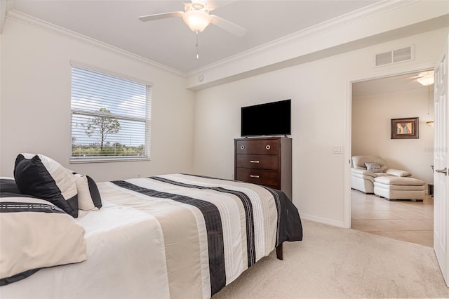 bedroom with light carpet, visible vents, baseboards, ceiling fan, and ornamental molding