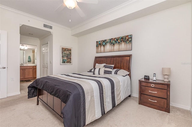 bedroom featuring light carpet, ensuite bathroom, visible vents, and baseboards