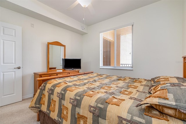 bedroom with ceiling fan and light colored carpet