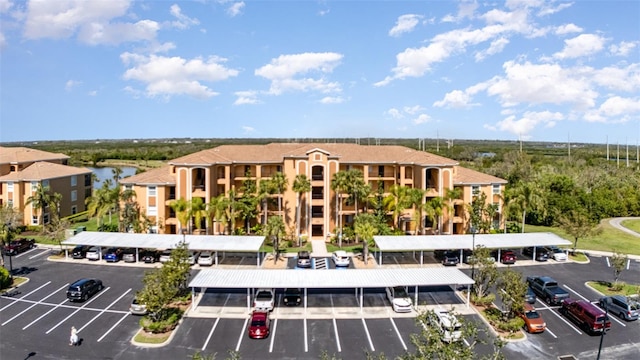 view of property with uncovered parking