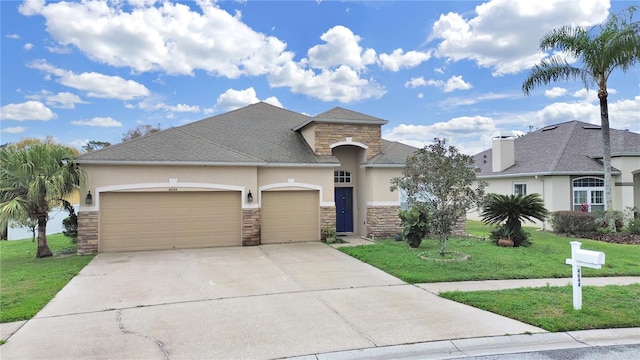 view of front of home featuring a garage, stone siding, a front lawn, and stucco siding