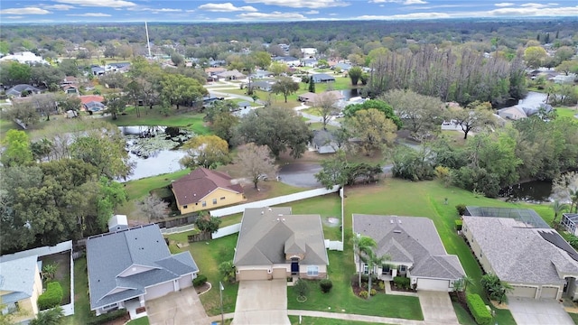 bird's eye view featuring a water view and a residential view