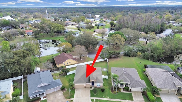 bird's eye view with a residential view and a water view