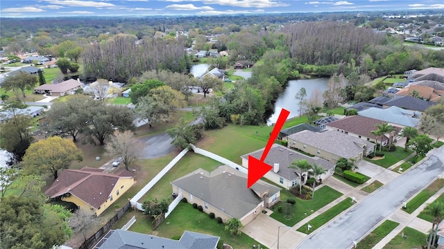 birds eye view of property with a residential view and a water view