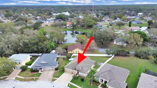 bird's eye view featuring a water view and a residential view