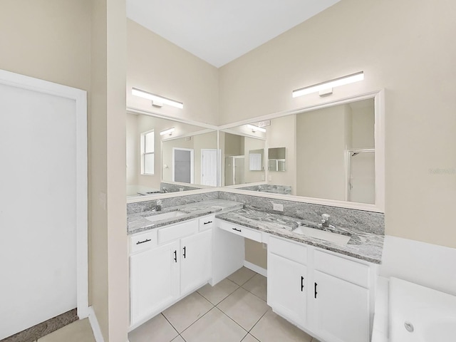 full bathroom featuring a tub, tile patterned flooring, a shower with door, and vanity