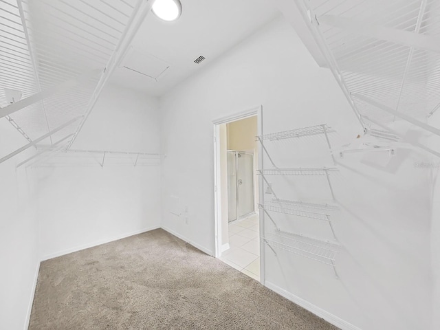 spacious closet featuring carpet and visible vents