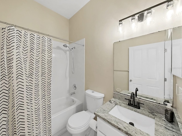 bathroom featuring vanity, toilet, and shower / bath combo with shower curtain