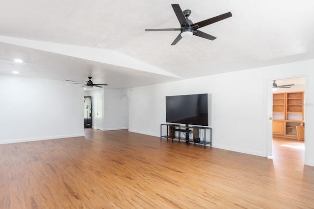 unfurnished living room featuring light wood-style flooring and baseboards