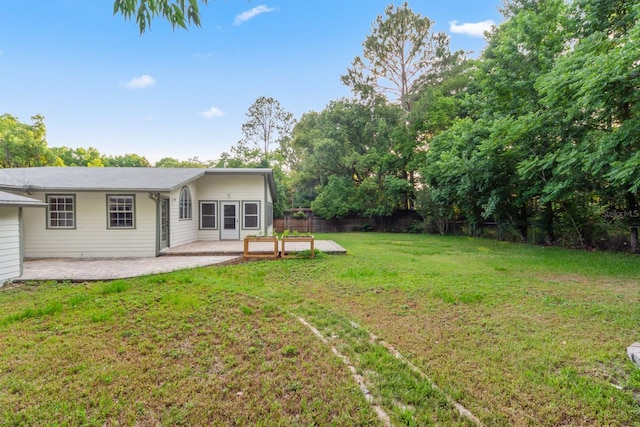 view of yard with fence and a patio