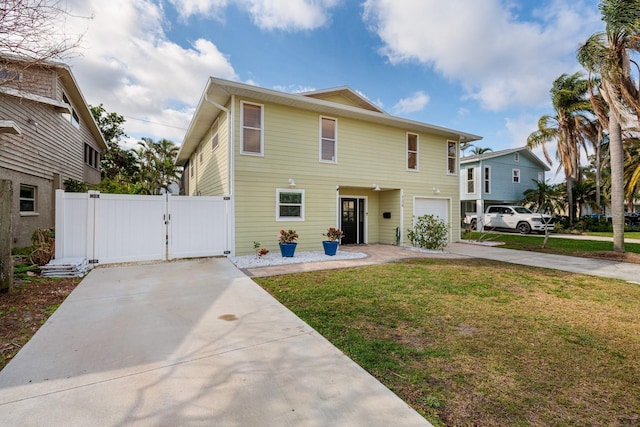 view of front facade featuring a front lawn, a gate, fence, and concrete driveway