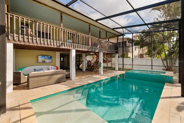 view of swimming pool with a fenced in pool, a patio, glass enclosure, stairway, and an outdoor living space