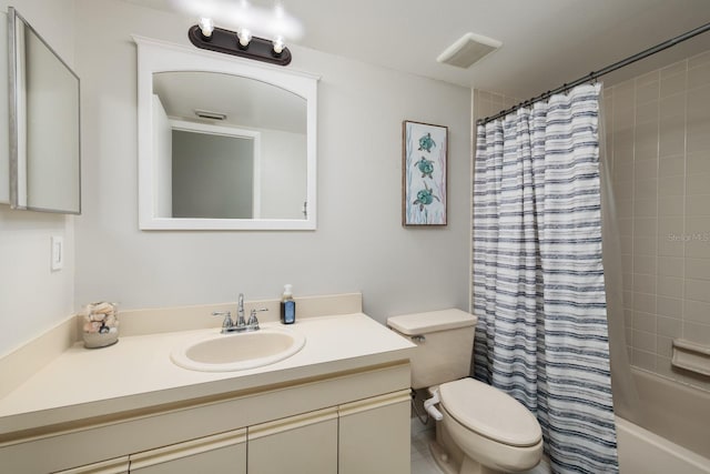 bathroom featuring shower / bath combination with curtain, visible vents, vanity, and toilet