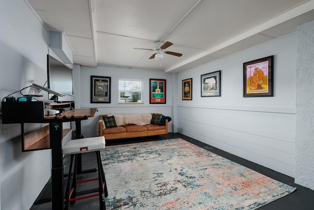 living area with a ceiling fan