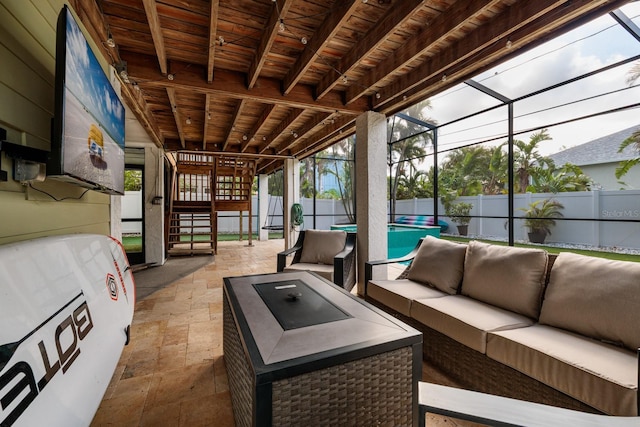 view of patio with glass enclosure, a fenced backyard, an outdoor living space, stairs, and a fenced in pool