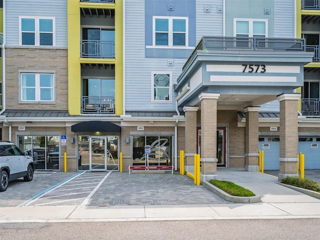 view of building exterior featuring covered parking