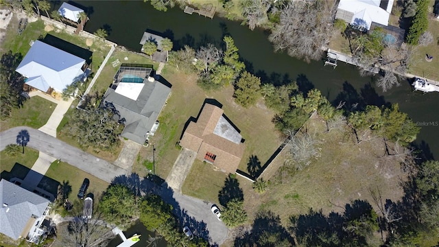 birds eye view of property with a water view and a residential view