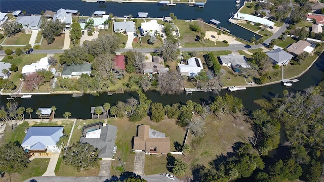 birds eye view of property with a water view and a residential view