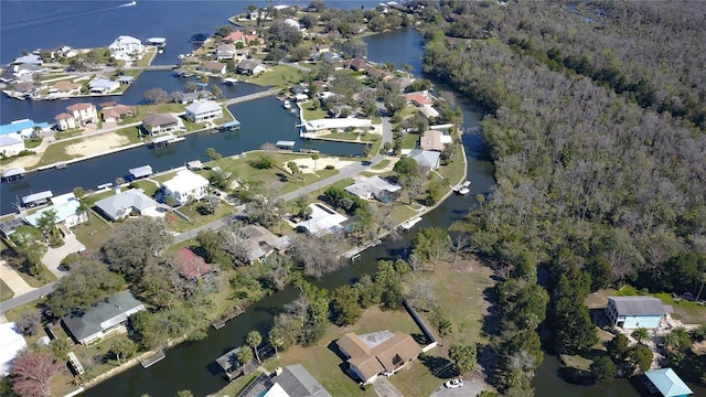 drone / aerial view with a residential view and a water view