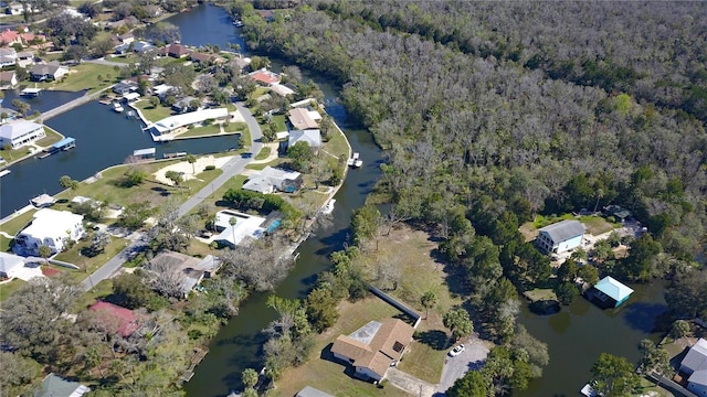 birds eye view of property with a water view and a residential view