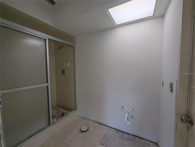 bathroom with a shower stall