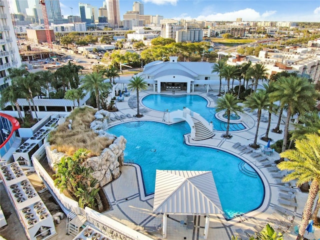 community pool featuring a patio and a city view