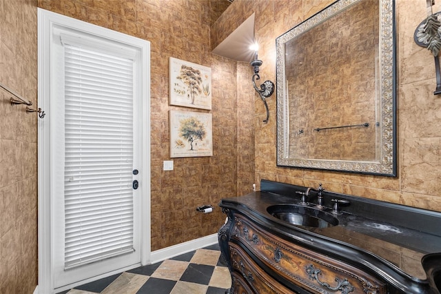 bathroom featuring vanity and baseboards