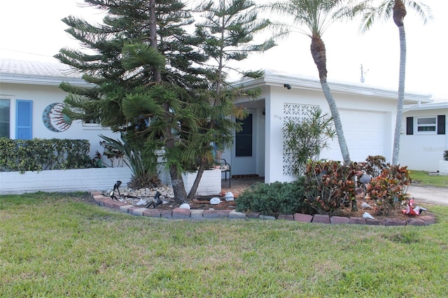 view of front of property featuring a front yard and stucco siding