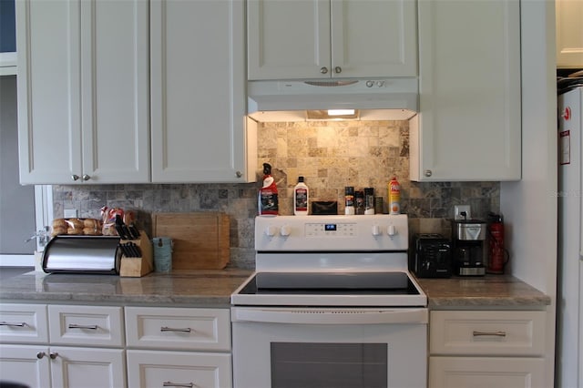 kitchen featuring under cabinet range hood, white electric stove, white cabinets, and decorative backsplash