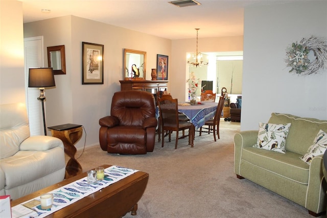 carpeted living area featuring visible vents and a chandelier