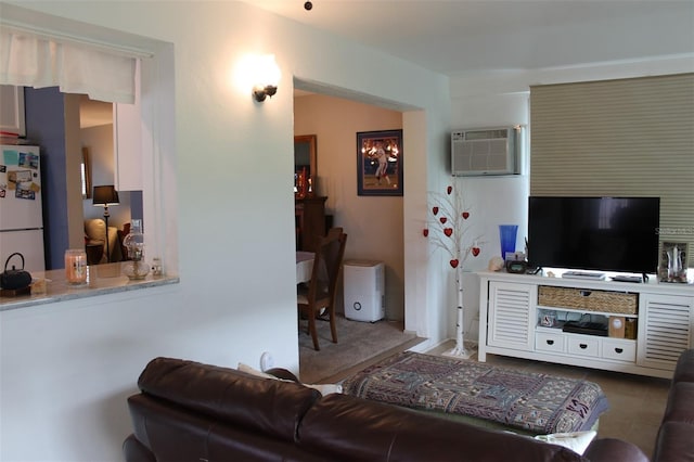 living area featuring a wall unit AC