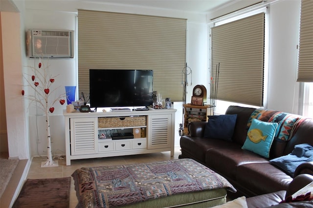 living room featuring tile patterned flooring and an AC wall unit