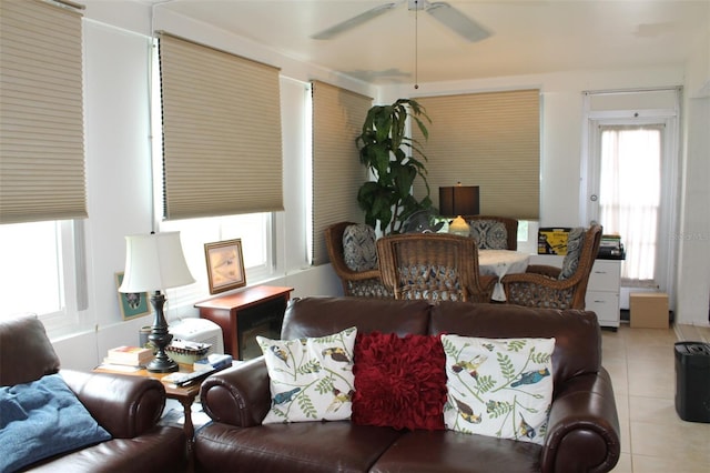 living area featuring ceiling fan and light tile patterned floors