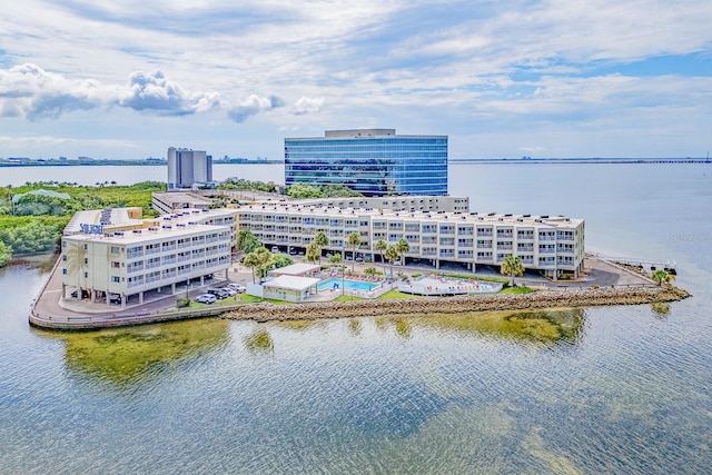 birds eye view of property with a view of city and a water view