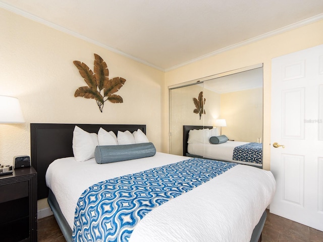 bedroom with ornamental molding and a closet