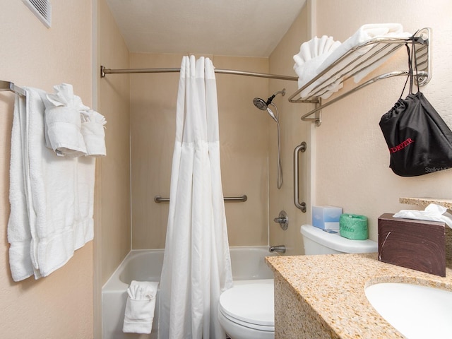 bathroom featuring toilet, shower / tub combo, and vanity