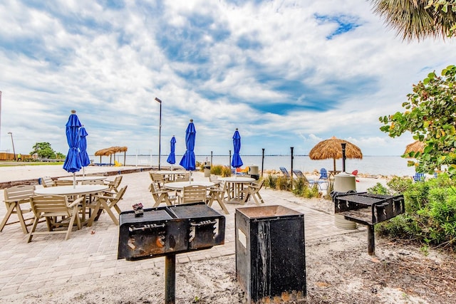 view of patio with a water view