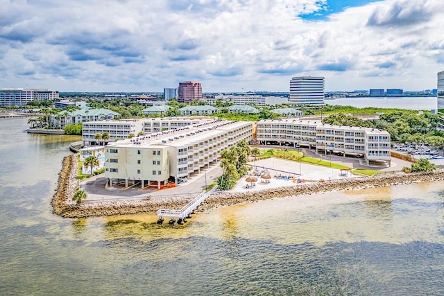 drone / aerial view featuring a water view and a view of city