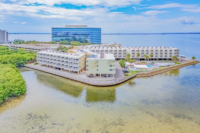 birds eye view of property featuring a view of city and a water view