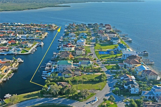 drone / aerial view with a residential view and a water view