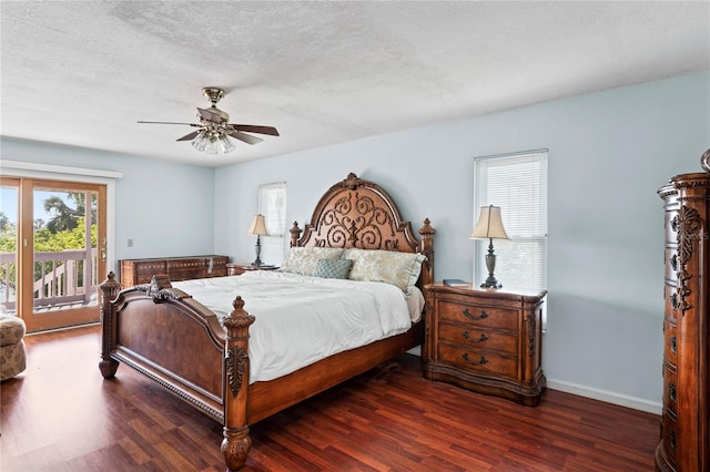 bedroom featuring a textured ceiling, baseboards, wood finished floors, and access to exterior