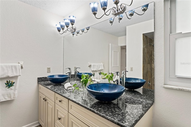 bathroom featuring double vanity and a sink