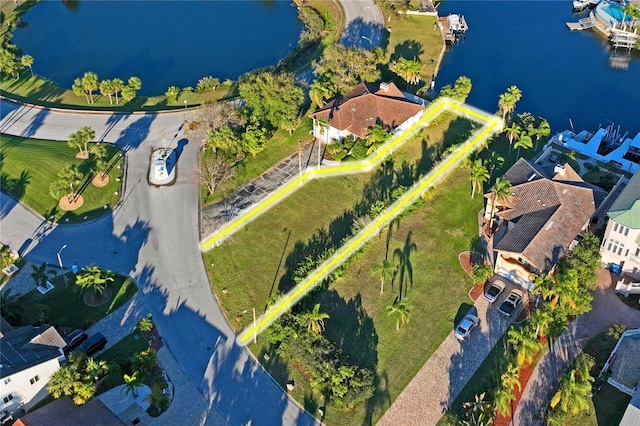 birds eye view of property with a water view